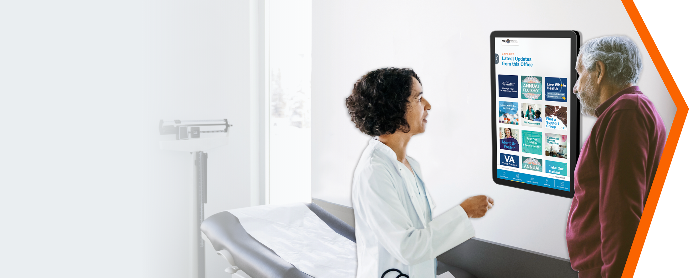 Female doctor and male patient interacting with an exam room display device.