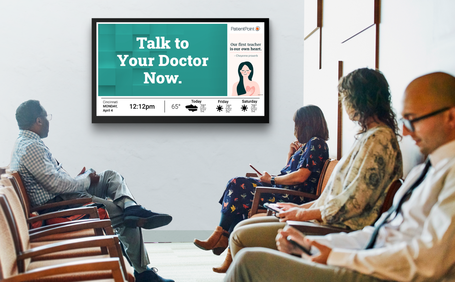 Doctor's office waiting room with patients looking at message on digital screen